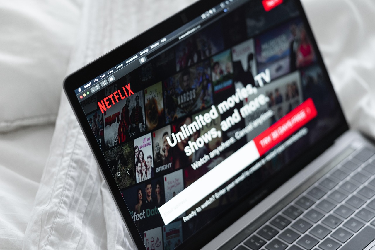 A laptop displaying Netflix's streaming interface